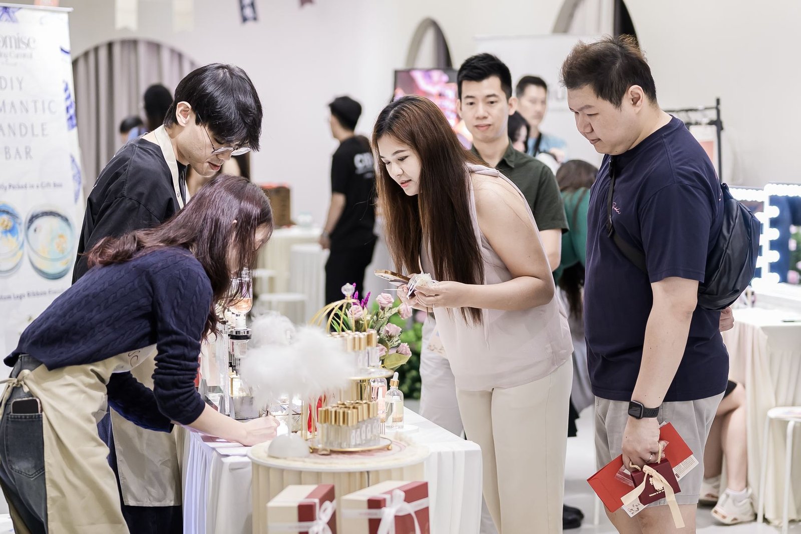 A wedding fair booth with candle bar and floral display